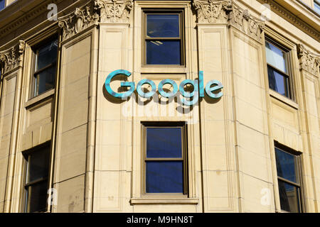 Green Google logo on the facade of the company's headquarters in downtown Montreal, province of Quebec, Canada. Stock Photo
