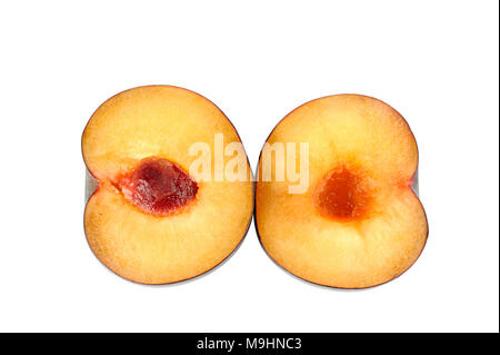 Plum halves on a white background Stock Photo