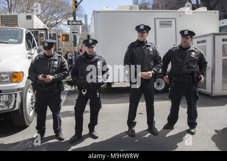 NYC, March 24, 2018: Students and many others demonstrated in the 'March For Our Lives' march all over the USA for an end to the slaughter of American students in schools and gun related deaths generally in the US. Nearly 200,000 marched in New York City. NYPD officers assigned to the parade. Stock Photo
