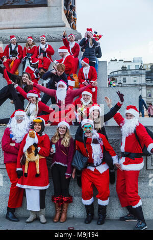 England, London, Trafalgar Square,Nelsons Column, People Dressed in Santa Costume Stock Photo