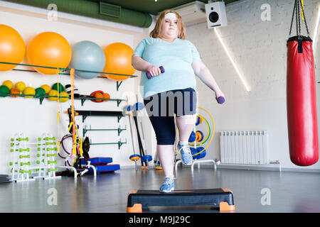 Obese Woman Doing Step Fitness Stock Photo