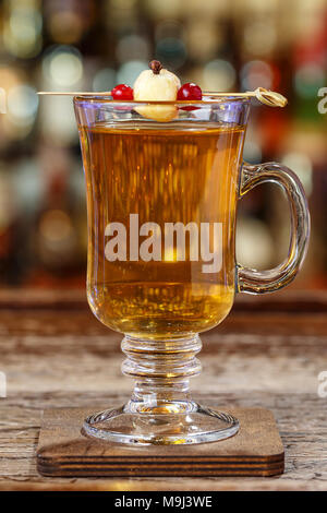 Hot non-alcoholic mulled wine, garnished with apple, space for text, photo for the bar menu, space for text Stock Photo