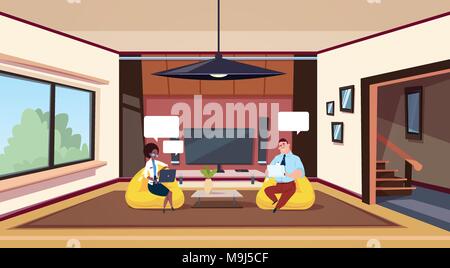 Couple Working On Computers Sit In Bean Bag Chairs In Modern Living Room Stock Vector