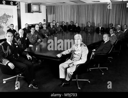 The Chiefs of Defence Staff grouped around the conference table in Whitehall at the height of the Falklands conflict. (L-R) Admiral of The Fleet Sir Terence Lewin, Chief of Defence Staff; Captain Raymond, Deputy Secretary, Chief of Staff's Committee; Admiral Sir Henry Leach, Chief of the Naval Staff and First Sea Lord; Lieutenant Colonel Bale, Assistant Secretary One; Air Chief Marshal Sir Michael Beetham, Chief of the Air Staff; Brigadier Eyre, Secretary, Chief of Staff's Committee; Commander Bickley, Assistant Secretary Two; Air Vice Marshal Gilbert, Assistant Chief of the Defence Staff (pol Stock Photo