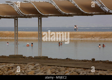 Neve Zohar, Israel. 26th Mar, 2018. Tourists swim in a evaporation pond in the southern part of the Dead Sea near the Neve Zohar resort, Israel, on March 26, 2018. The sinkholes have reshaped the landscape around the Dead Sea, making Neve Zohar a more popular tourist destination for local residents. Credit: Gil Cohen Magen/Xinhua/Alamy Live News
