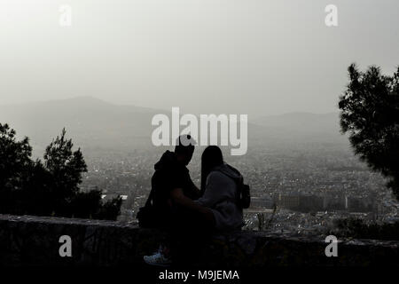 Athens, Greece. 26th Mar, 2018. Tourists overlook the city of Athens blanketed in dust storm on Lycabetus hill in Athens, Greece, March 26, 2018. Credit: Lefteris Partsalis/Xinhua/Alamy Live News Stock Photo