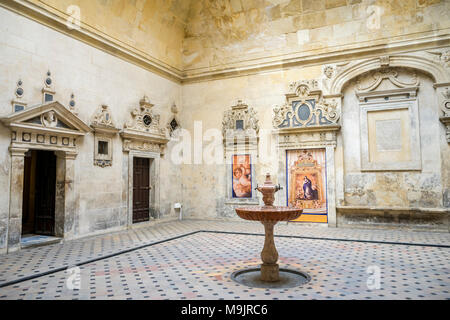 Patio inside the Sevilla Cathedral (Cathedral of Saint Mary of the See) with an old fountain in the middle, Seville, Andalusia, Spain Stock Photo