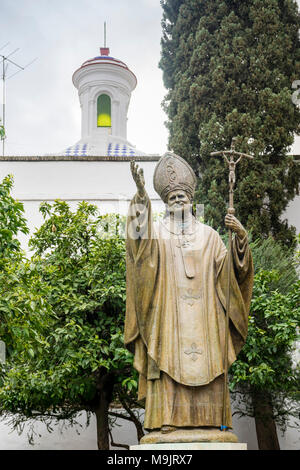 Plaza Virgen de los Reyes - the bronze statue of Pope John Paul II in the centre of the Spanish city of Seville, Andalusia, Spain Stock Photo