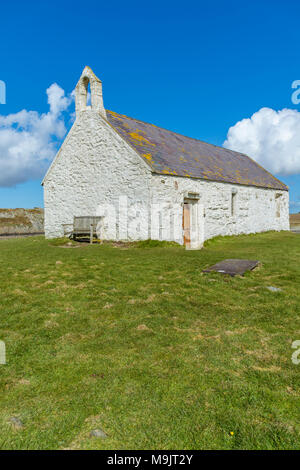 UK, Anglesey, Aberffraw. 25th March 2018. A view of St Cwyfan Island Church in the sea. Stock Photo