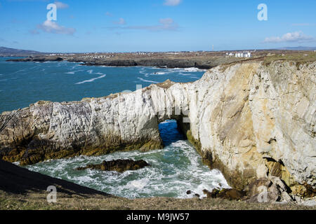 Bwa Gwyn or White Arch natural rock formation of Holyhead Quartzite rocks on seacliffs in Penrhyn Bay. Rhoscolyn Holy Island Isle of Anglesey Wales UK Stock Photo