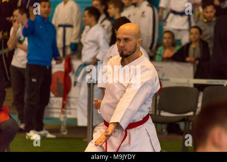 Lviv , Ukraine - March 25, 2018: International open karate cup . Unknown athlete performs during the competition  in the sports complex of the army,   Stock Photo