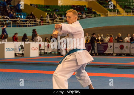 Lviv , Ukraine - March 25, 2018: International open karate cup . Unknown athlete performs during the competition  in the sports complex of the army,   Stock Photo