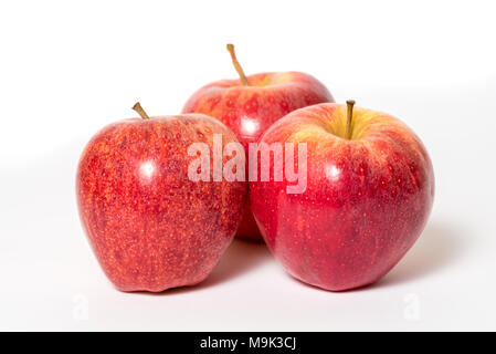 Three fresh red apples isolated on a white background Stock Photo