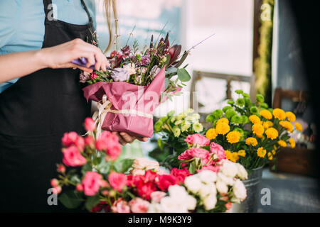 close up photo of florist's master class teaching how to prepare wonderful bouquets Stock Photo