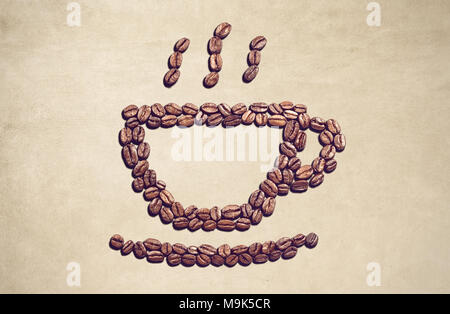 Coffee cup symbol made out of coffee beans Stock Photo