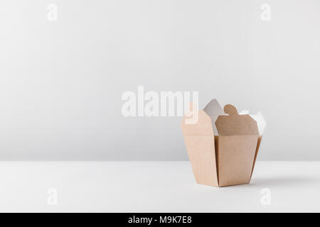 one open noodles box on white surface Stock Photo