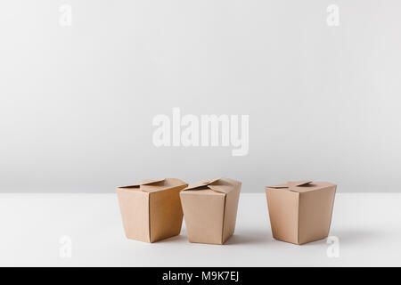 three noodles boxes on white surface Stock Photo