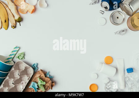 flat lay with arranged different types of garbage isolated on grey Stock Photo