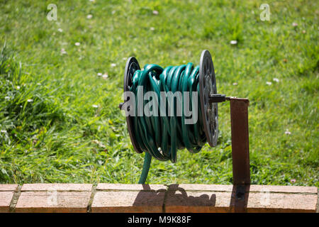 Close-up of a rolled up garden hose Stock Photo