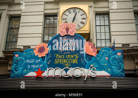 Macy's flagship department store in Herald Square in New York is festooned with floral arrangements for the 44th annual Macy's Flower Show, on opening day Sunday, March 25, 2018. Visitors flock to this year's show, whose title and theme is 'Once Upon a Springtime', to enjoy the thousands of flowers in horticultural displays evoking a magical kingdom. The show runs until April 8.  (Â© Richard B. Levine) Stock Photo