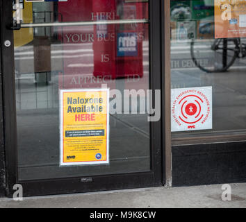 A sign on the door of a pharmacy in New York on Tuesday, March 20, 2018 informs customers that the store carries Naloxone, a drug used to treat opioid overdoses. President Donald Trump recently announced that as part of his plan to combat the country's opioid crisis he will try to get an expansion of the federal death penalty. (Â© Richard B. Levine) Stock Photo