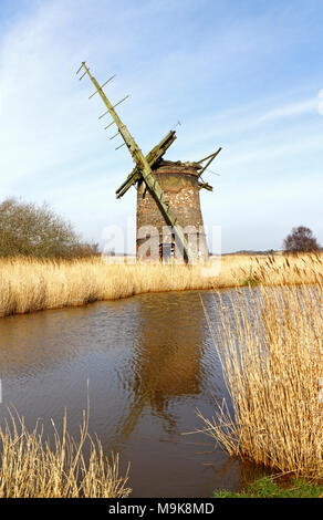 A view of Brograve Drainage Mill on the Norfolk Broads at Horsey, Norfolk, England, United Kingdom, Europe. Stock Photo