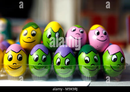 Funny Easter eggs. Colorful painted eggs with funny faces. Stock Photo