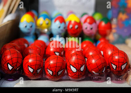 Funny Easter eggs. Colorful painted eggs with Spiderman and funny faces. Stock Photo