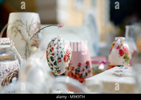 Decoupage technique. VIntage style. Shabby chic wooden boxes, glass jar and Easter egg. Stock Photo