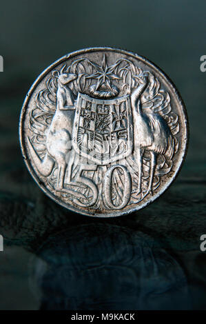 Relatively rare Australian1961 80% silver round 1961 fifty cent coin in studio settiong Stock Photo