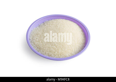 Sugar on a plate is weighed by a recipe and prepared for making a cream for a cake or dough Stock Photo