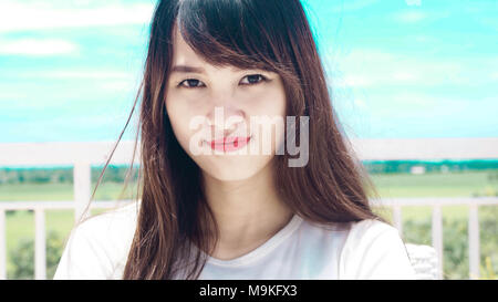beautiful young asian woman look at the camera and smile Stock Photo