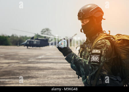 Hand in glove with the parachutist altimeter close up. Stock Photo