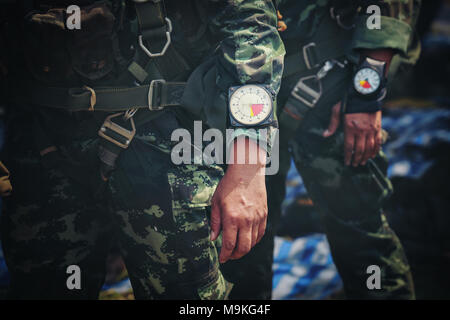 Hand in glove with the parachutist altimeter close up. Stock Photo