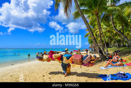 Trou-aux-Biches, Mauritius - Jan 4, 2017. Vendors on beach in Trou-aux-Biches, Mauritius. Trou-aux-Biches is a beach-town on the northern coast of Mau Stock Photo