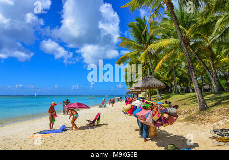 Trou-aux-Biches, Mauritius - Jan 4, 2017. Vendors on beach in Trou-aux-Biches, Mauritius. Trou-aux-Biches is a beach-town on the northern coast of Mau Stock Photo