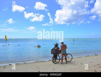 Trou-aux-Biches, Mauritius - Jan 4, 2017. People on beach in Trou-aux-Biches, Mauritius. Trou-aux-Biches is a beach-town on the northern coast of Maur Stock Photo