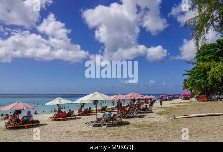 Trou-aux-Biches, Mauritius - Jan 4, 2017. People on beach in Trou-aux-Biches, Mauritius. Trou-aux-Biches is a beach-town on the northern coast of Maur Stock Photo