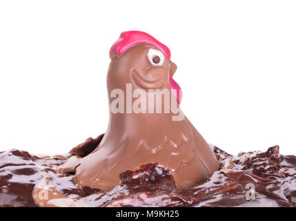 Melting chocolate easter chicken - Isolated on white background Stock Photo