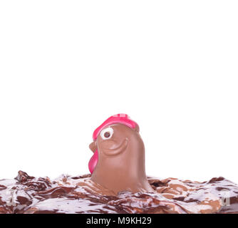 Melting chocolate easter chicken - Isolated on white background Stock Photo