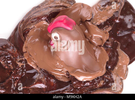 Melting chocolate easter chicken - Isolated on white background Stock Photo