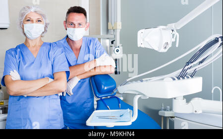 Portrait of two friendly professional dentists standing in modern medical office Stock Photo