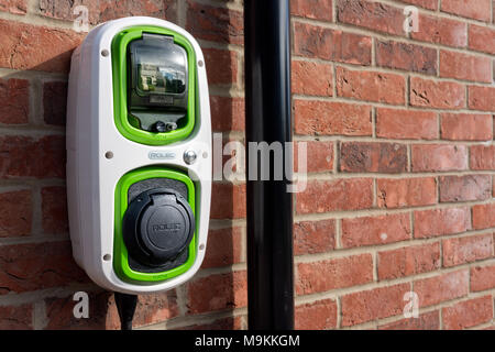 A Rolec, domestic, electric car charging point on the wall of a home. Stock Photo