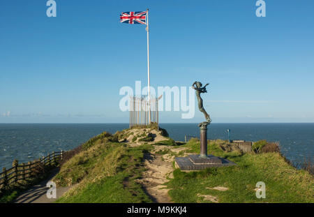 British Union Flag flying from flagpole on headland at Ilfracombe in Devon, England. With Bristol Channel behind. Stock Photo