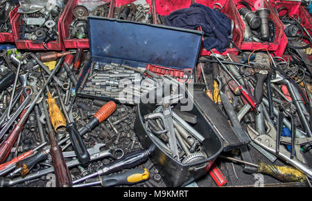Bunch of messy hand tools in an auto mechanic garage Stock Photo