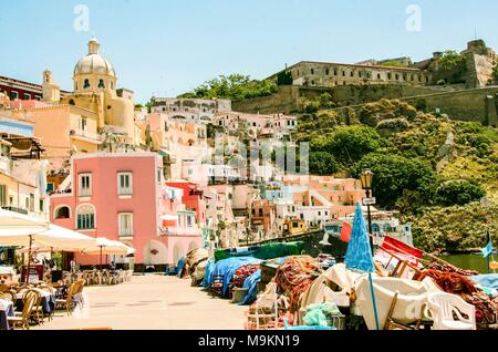 At Procida - Naples- Italy-  ON  06/27/2014 the charming port of Corricella  with its colorful fishermen houses, island of Procida Naples, Italy Stock Photo