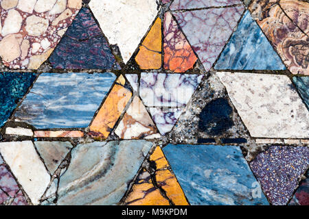 Colourful rhombic tiles of a marble mosaic floor at the ancient city of Herculaneum, Italy Stock Photo