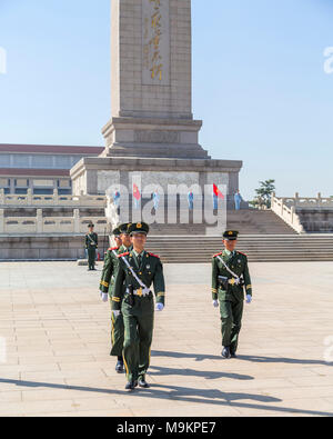 Chinese soldiers marching in front of the Monument to the People's Heroes, Tiananmen Square, Beijing, China Stock Photo