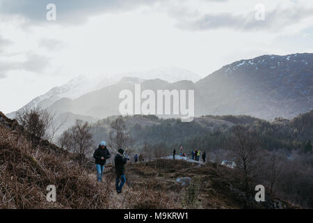 People on a viewing platform near Glenfinnan Viaduct, Scotland. The viaduct is featured in two Harry Potter movies with Hogwards Express. Stock Photo
