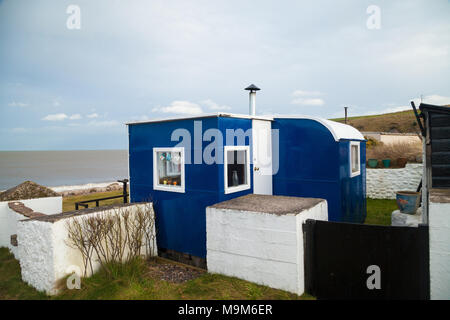 A small caravan converted into a holiday home in Corbie Knowe near Lunan Bay Angus Scotland. Stock Photo